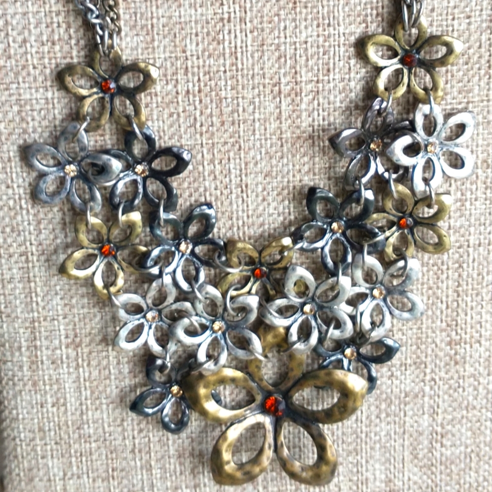 Multi tone bib necklace metal floral design with rhinestone center statement
